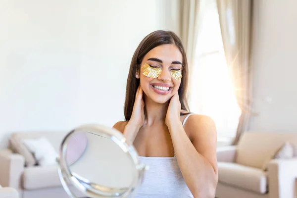 Portrait of pretty, nice grandmother with eye patches, having bags under eyes in the morning because of less sleep, showing an effect of perfect skin