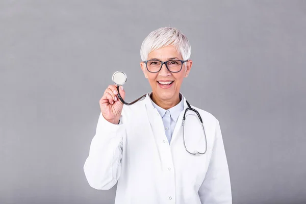 Female mature doctor with a stethoscope in the hands isolated on background. Doctor holds his stethoscope to insinuate that it\'s time for a check up in clinic banner