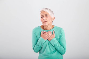 Woman having a pain in the heart area. Heart Attack. Painful Chest. Health Care, Medical Concept. High Resolution. Woman having heart attack at home