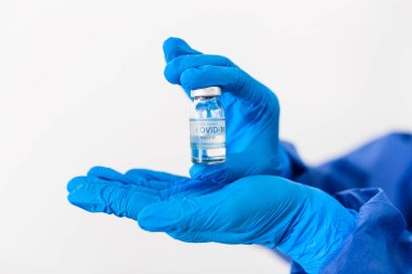 Female doctor holding COVID-19 vaccine. Healthcare And Medical concept.Vaccine vial dose flu shot drug needle syringe,medical concept vaccination hypodermic injection treatment