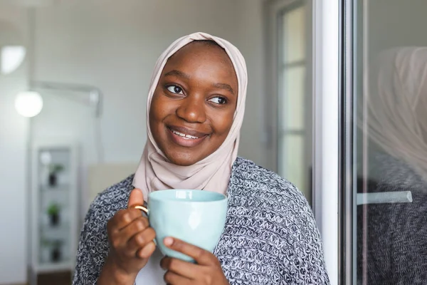 Portrait of young Asian Muslim woman in head scarf smile. Pearl From The East. Smiling Muslim Woman Wearing Hijab. Modern, Stylish and Happy Muslim Woman Wearing a Headscarf