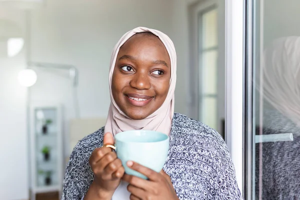 Portrait of young Asian Muslim woman in head scarf smile. Pearl From The East. Smiling Muslim Woman Wearing Hijab. Modern, Stylish and Happy Muslim Woman Wearing a Headscarf