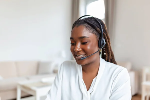 Business woman with headsets working with computer at office. Customer service assistant working in office.woman operator working with headsets and laptop at telemarketing customer service. callcenter