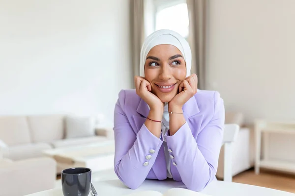 Portrait of smiling muslim woman in home office. Confidence pretty muslim woman Business and finance concepts.
