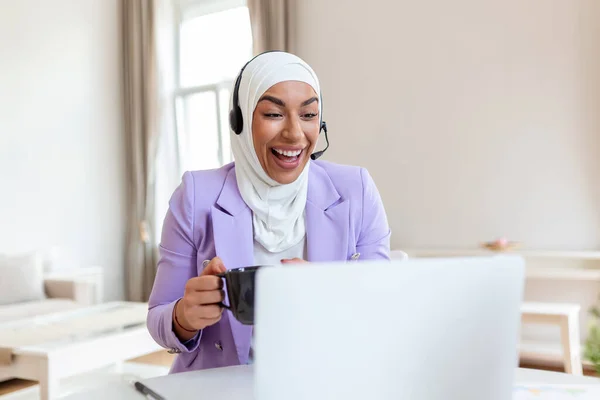 Muslim Business woman with headsets working with computer at office. Customer service assistant working in office.woman operator working with headsets and laptop at telemarketing customer service. callcenter