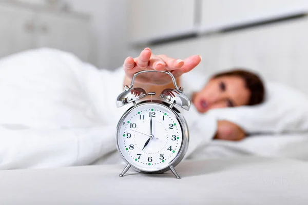 Woman Lying Bed Turning Alarm Clock Morning 7Am Hand Turns — Stockfoto