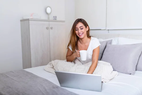 Beautiful Young Woman Drinking Coffee Home Her Bed Wearing Cozy — Foto de Stock