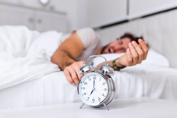 Man Lying Bed Turning Alarm Clock Morning 7Am Hand Turns — Stock Photo, Image