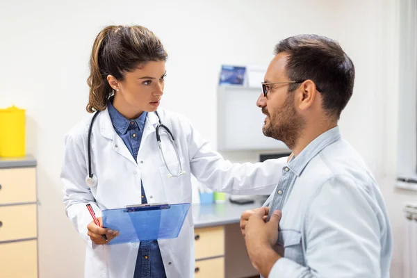 Experienced Doctor Discussing Patient His Private Medical File Young Man — Stock Photo, Image