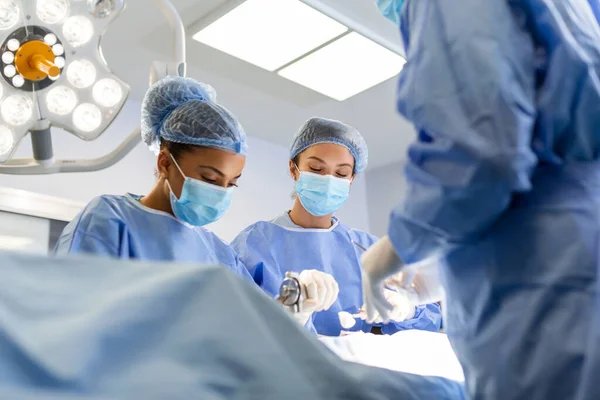 Multi Ethnic Healthcare Workers Performing Surgery Patient Operation Theater Medical — Foto Stock