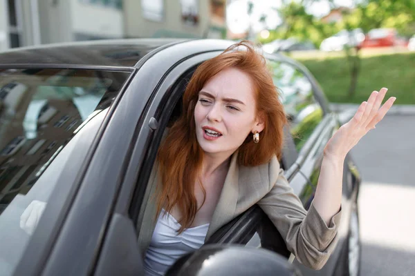 Displeased Woman Looking Out Side Window Pointing Hand While Driving — Stock Photo, Image