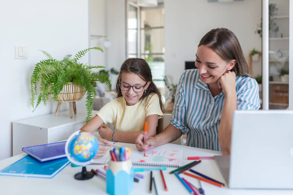 Covid-19 Coronavirus and Learning from home, Home school kid concept. Little girl study with mother help. Quarantine and Social distancing concept. Learning at home, online learning.