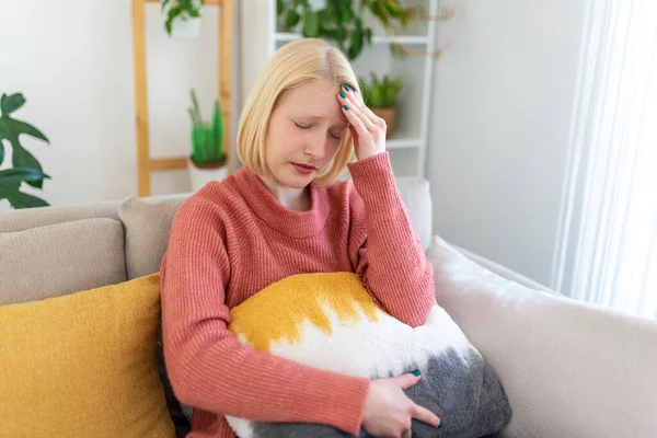 Portrait Young Blond Woman Sitting Couch Home Headache Migraine Beautiful —  Fotos de Stock