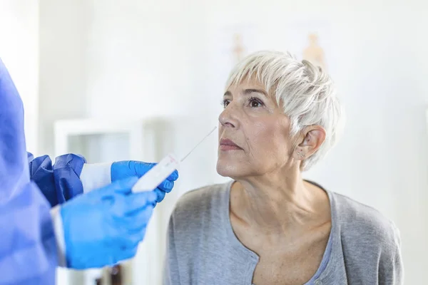 Healthcare Worker Protective Equipment Performs Coronavirus Swab Mature Woman Nose — Stock Photo, Image