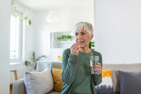 Senior Woman Takes Pill Glass Water Hand Stressed Female Drinking — Stock Photo, Image