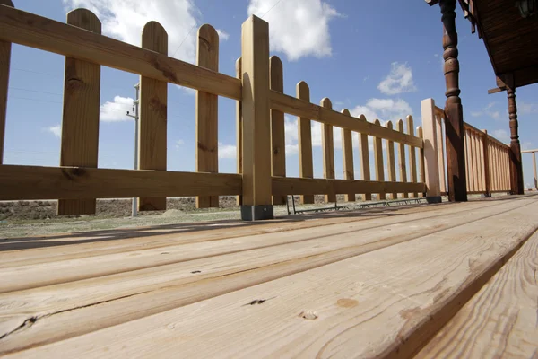Wooden fence, flooring, gazebo — Stock Photo, Image