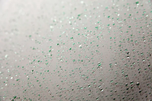 Falling raindrops on glass — Stock Photo, Image