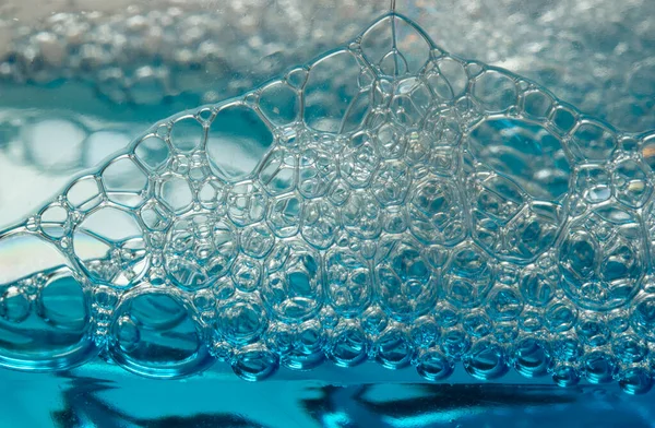 青色の石鹸泡のクローズ アップの抽象的な背景テクスチャ — ストック写真