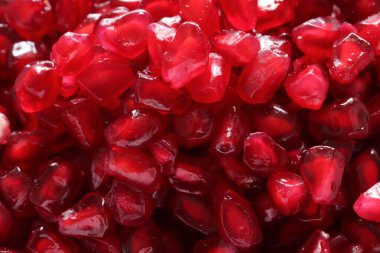 Pomegranate seeds close-up macro background