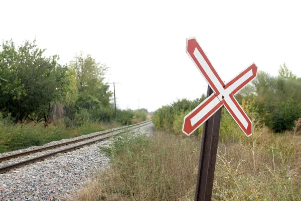 Single track railway crossing sign