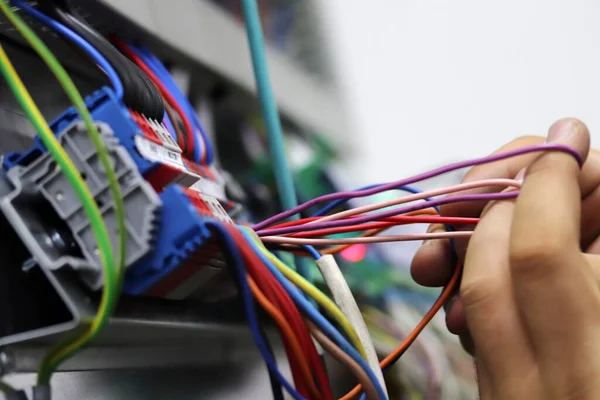 Close-up of a technician\'s hands.