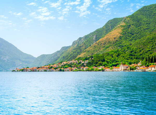 Landscape of the the historic town of Prcanj on the shore of Bay of Kotor, with view to Church of the Nativity of the Blessed Virgin Mary, Montenegro
