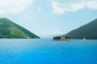 Landscape of the Bay of Kotor coastline - Boka Bay with view to the Saint George Benedictine monastery on the islands,  Montenegro
