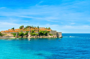 Budva, Montenegro - July 24, 2022: Beautiful  summer landscape of the Adriatic coast in The Budva Riviera with a view of the Sveti Stefan