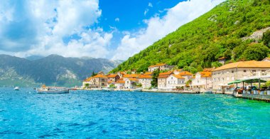 Perast, Montenegro - May 28, 2022: Beautiful panoramic landscape with the historic town of Perast on the shore of the Boka Bay - Bay of Kotor