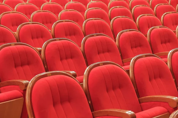 Fondo de las sillas rojas teatrales rojas — Foto de Stock