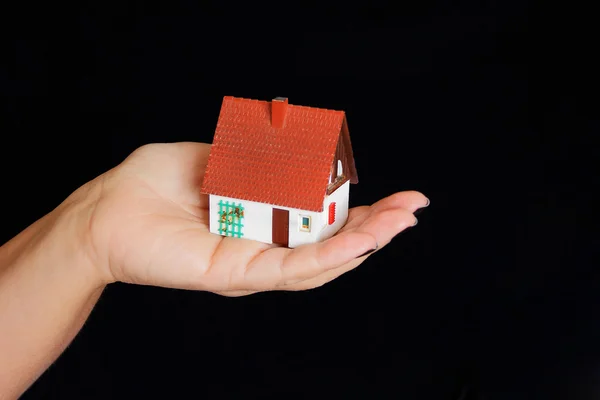 Dollhouse in human hand — Stock Photo, Image