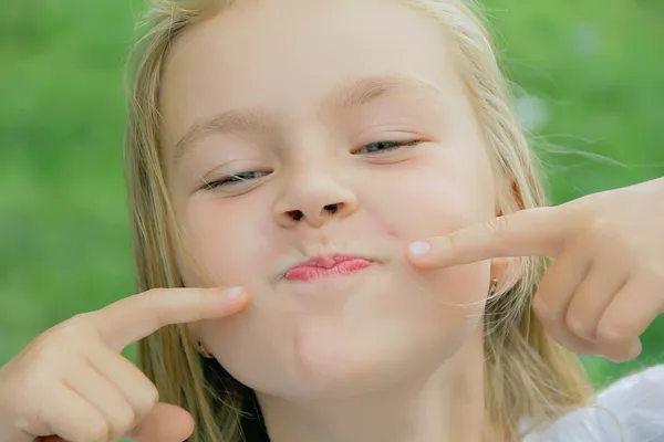 Girl makes faces — Stock Photo, Image