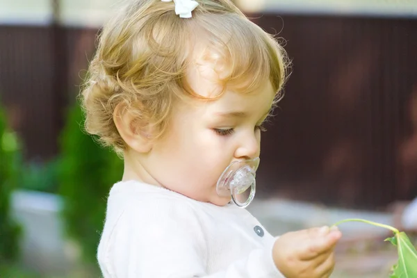 Cute infant with nipple — Stock Photo, Image