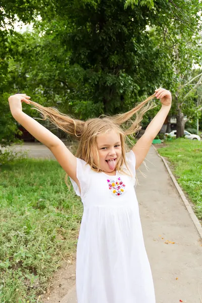 Girl makes faces imitate witch — Stock Photo, Image