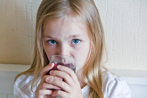 Cute girl drinking beverage — Stock Photo, Image