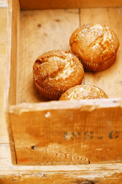 Three poppy seeds and lemon muffins in wooden box — Stock Photo, Image