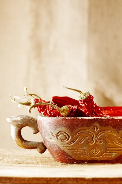 Red hot chillies pepper in old wooden bowl — Stock Photo, Image