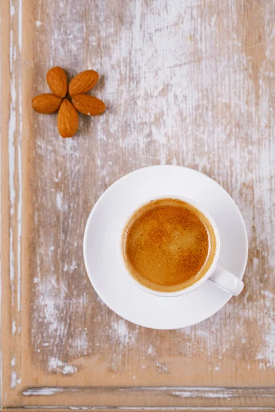 Espresso coffee and almonds on old rustic table — Stock Photo, Image