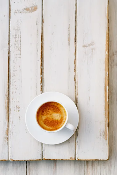 Espresso coffee in white cup on old rustic style table — Stock Photo, Image