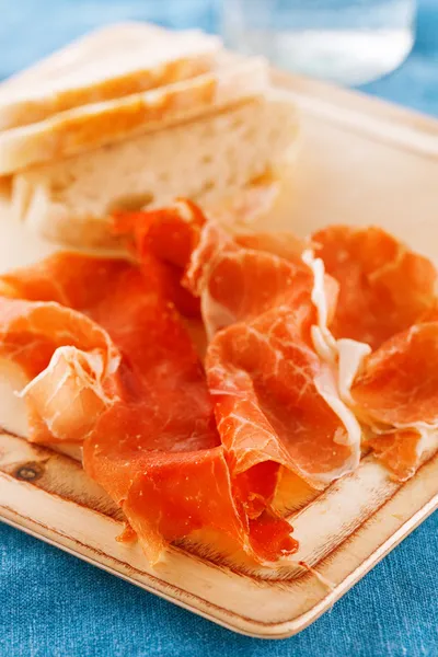Platter of serrano jamon Cured Meat and ciabatta — Stock Photo, Image