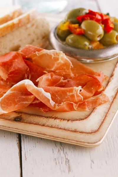 Platter of serrano jamon Cured Meat and ciabatta — Stock Photo, Image