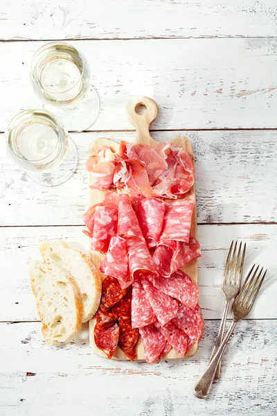 Platter of serrano jamon Cured Meat and ciabatta — Stock Photo, Image