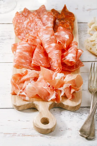 Platter of serrano jamon Cured Meat and ciabatta — Stock Photo, Image