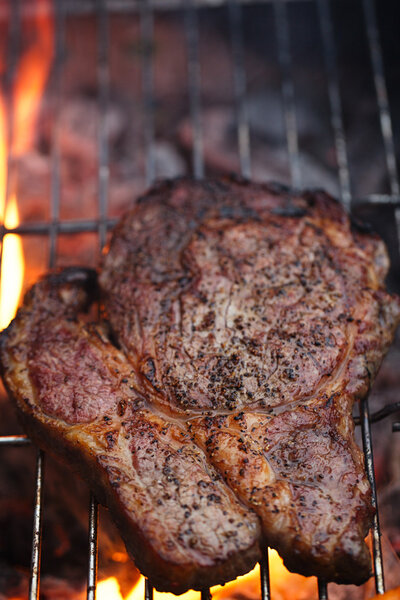 food meat - rib eye beef steak on party summer barbecue grill wi