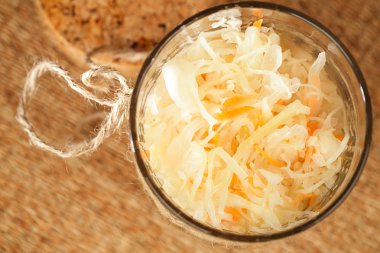 Sour cabbage - sauerkraut - in glass jar clipart