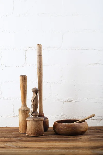 Mashers retro kitchen utensils on old wooden table in rustic st — Stock Photo, Image