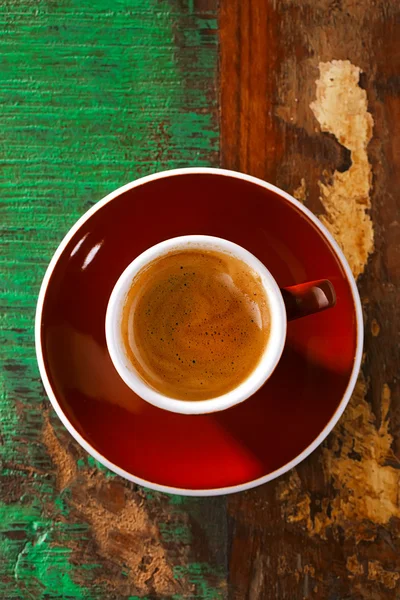 Espresso coffee on rustic table in brown cup — Stock Photo, Image