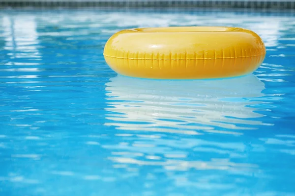 Floating ring on blue water — Stok fotoğraf