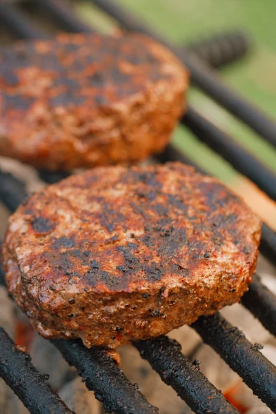 Food meat - burgers on bbq barbecue grill — Stock Photo, Image