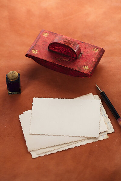 vintage red leather ink blotter  with retro post cards on leathe